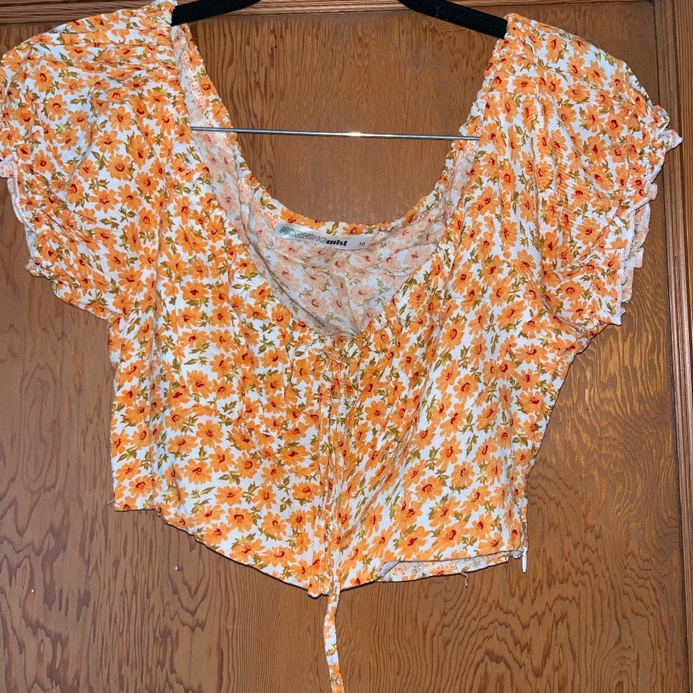 Orange and white floral top with puff sleeves